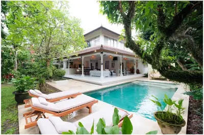 an image of a house with a swimming pool at Villa Hari in Seminyak