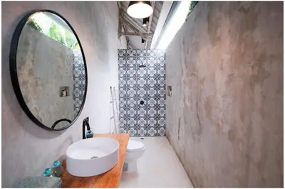 a bathroom with a sink and a mirror at Villa Hari in Seminyak