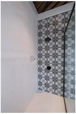 a room with a floral pattern on the wall at Villa Hari in Seminyak