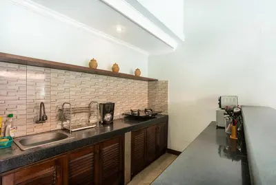 a kitchen with a sink and a counter top at Lacita Villa Seminyak in Seminyak