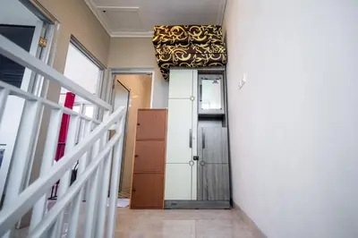 a hallway with a door and a gold ceiling at Rumah Jimbaran Kuta 2 bedroom 6 pax SukaBali 5 in Jimbaran