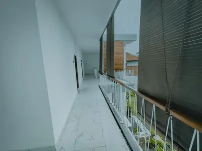 an empty balcony of a building with a fence at Pachira Living Legian in Legian