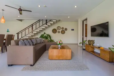 a living room with a couch and a coffee table at Luxury 4 Bedroom Villa Seminiak in Seminyak