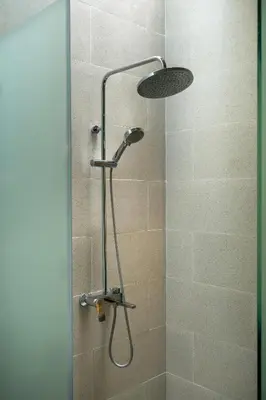 a shower with a shower head in a bathroom at Deneva Villa by Betterplace in Canggu