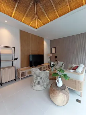a living room with a couch and a table at Deneva Villa by Betterplace in Canggu