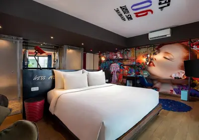 a bedroom with a large white bed in a room at Viva Dash Hotel Seminyak in Seminyak