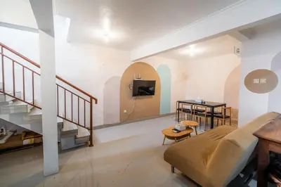 a living room with a couch and a table at House Jimbaran Kuta 3 bedroom 8 pax SukaBali 6 in Jimbaran