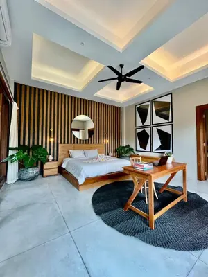 a bedroom with a bed and a ceiling fan at 2 BR Villa Near Seminyak Beach in Seminyak