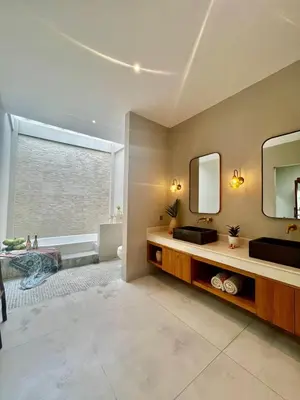 a bathroom with a sink and a mirror at 2 BR Villa Near Seminyak Beach in Seminyak