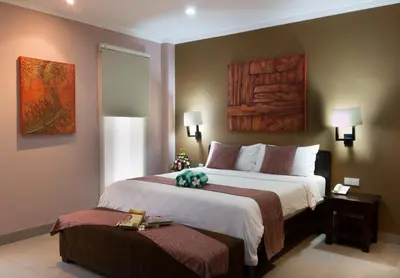 a hotel room with two beds at Peninsula Bay Resort in Nusa Dua