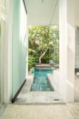 a swimming pool in the middle of a house at Villa Sassy - Stunning Private Award Winning Seminyak Oasis in Seminyak