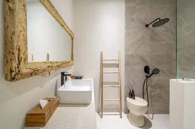 a bathroom with a toilet and a sink at Alisa 4 - Luxurious 4BR Villa with Garden Views and Pool in Seminyak