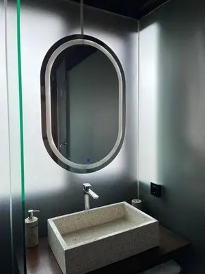 a bathroom with a sink and a mirror at Wakajima House kuta Utara in Kerobokan