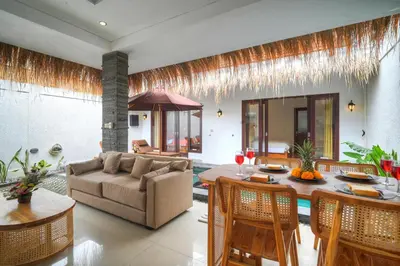 a living room with a couch and a table at Villa Bella Wilson III in Seminyak