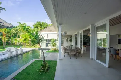 an external view of a house with a swimming pool at Bali Modern Escape With Private Pool, 8 guests in Kerobokan