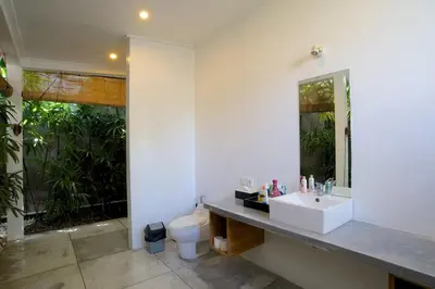 a bathroom with a sink and a toilet at Your Tropical Oasis Mason Villas Seminyak in Seminyak