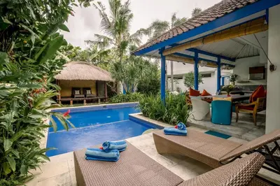 a villa with a swimming pool and a resort at Your Tropical Oasis Mason Villas Seminyak in Seminyak