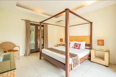 a bedroom with a canopy bed in a room at 4 Bedroom Private Villa Umalas 2 in Seminyak