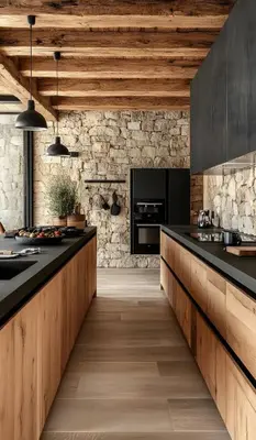 a kitchen with black countertops and a stone wall at 4 Bedroom Private Villa Umalas 2 in Seminyak
