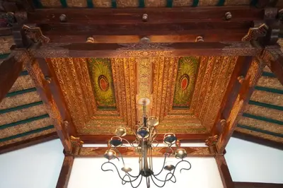 a chandelier hanging from the ceiling of a building at Oemah Djoglo Kerobokan in Kerobokan