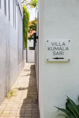 a sign on a building that reads villa kuniya sahib at Villa Kumala Sari in Seminyak