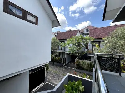 a view from the balcony of a house at Grand Kesambi Family Villa by Miel Property in Seminyak