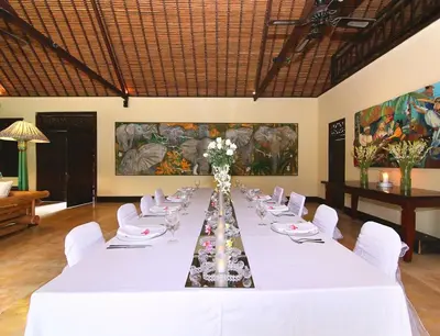 a large white table with white chairs and a long table at Large Private Villa, central Seminyak, Bali in Seminyak