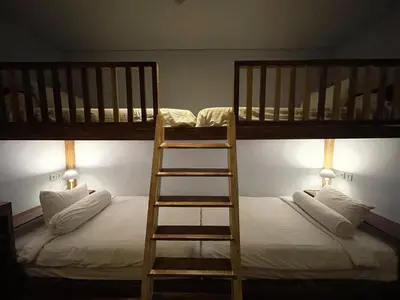 a room with two bunk beds with a ladder at Large Private Villa, central Seminyak, Bali in Seminyak