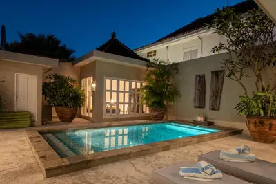 a swimming pool in the backyard of a house at VILLA BELLA - 7Min Beach Access - 10min to Canggu in Canggu