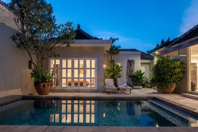 a swimming pool in front of a villa at VILLA BELLA - 7Min Beach Access - 10min to Canggu in Canggu