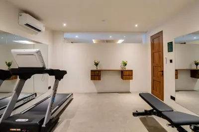 a gym with cardio equipment in a room at Avanya Luxury Apartment by Pertama Management in Seminyak
