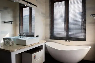 a bathroom with a white tub and a sink at Villa Manis with a private pool in Nusa Dua in Nusa Dua