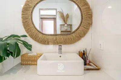 a bathroom with a white sink and a mirror at Bambola - Stunning Luxury Villa in Kerobokan in Canggu