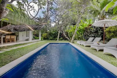 a pool in the backyard of a villa at Villa Lodek Deluxe in Seminyak
