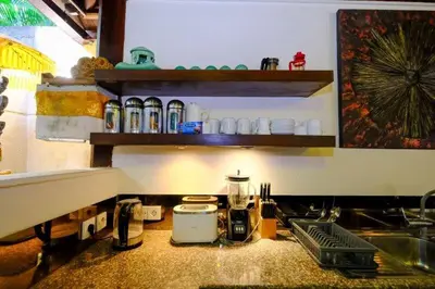 a kitchen with a counter top with a coffee maker at Villa Jepun Seminyak in Canggu