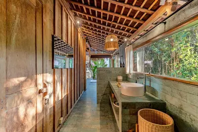 a bathroom with a sink and a large window at Villa Madah - Secluded & Romantic Retreat 1BR Near Umalas with Private Pool & View in Kerobokan