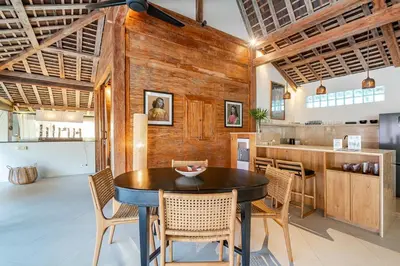a kitchen and dining room with a table and chairs at Villa Madah - Secluded & Romantic Retreat 1BR Near Umalas with Private Pool & View in Kerobokan