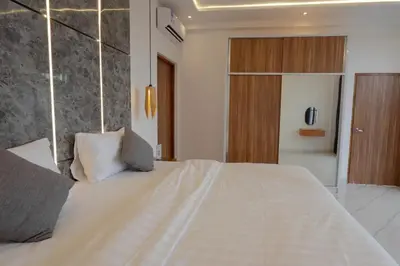 a bedroom with a large white bed in a room at Cozy Seminyak Loft 3 Bedroom Private Villa in Seminyak