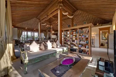 a living room with a couch and a table at Kudus Boutique Estate in Canggu 100m to Beach in Canggu