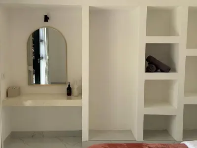 a white bathroom with a mirror and a sink at LUX 2 Bed Villa - Berawa in Canggu
