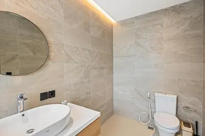 a bathroom with a sink and a toilet at New 3 BR Luxury Villa in Umalas in Canggu