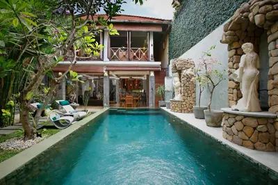 a swimming pool in the backyard of a house at Villa SanSam Seminyak in Seminyak