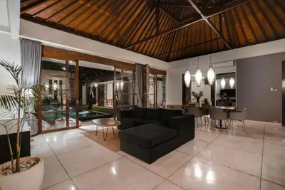 a living room with a couch and a table at Villa Duadewi 3BR in the Heart of Seminyak by Santi Management in Seminyak