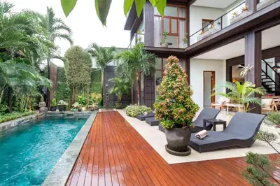 a pool in the middle of a house at Villa Eden - Seminyak in Seminyak