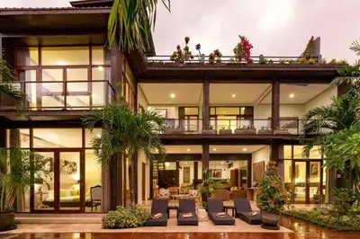 a large house with a lot of windows at Villa Eden - Seminyak in Seminyak