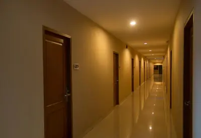 a hallway of a building with a row of doors at Seminyak Square Hotel And Villas in Seminyak