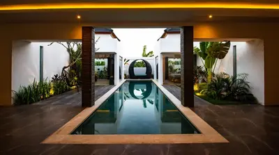 a swimming pool in the middle of a house at Villa Yolanda - Seminyak Beach in Seminyak