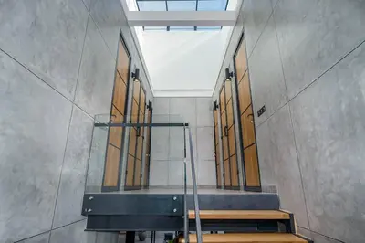 a hallway with a staircase in a building at Family Luxury 5bd Villa Parking X Walk 2 Potato Head in Seminyak