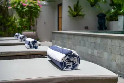 a group of towels sitting on a table at Family Luxury 5bd Villa Parking X Walk 2 Potato Head in Seminyak