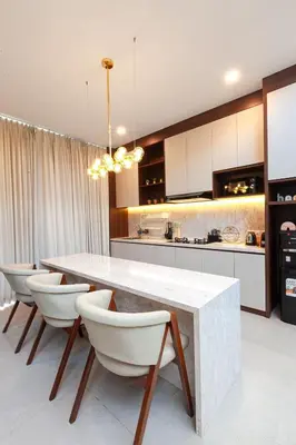 a kitchen with a white table and white chairs at Yearly Rent Seminyak Huis19 Villa in Seminyak